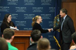 Governor Sununu shaking hands with a student