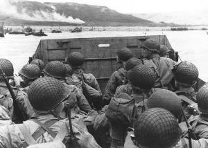 U.S. soliders in a landing craft approaching a beach on D-Day