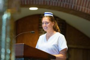 Student nurse speaking to her peers in the Abbey Church