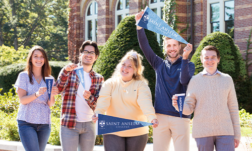 students holding pennants