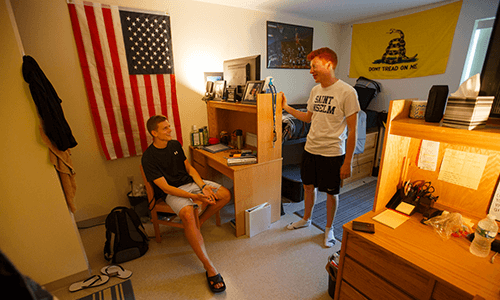 two roommates talking in their dorm room