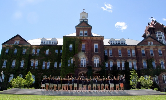 students standing in front of alumni hall 