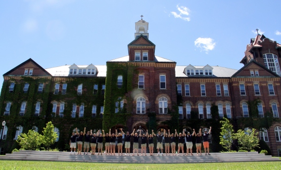 students standing in front of alumni hall