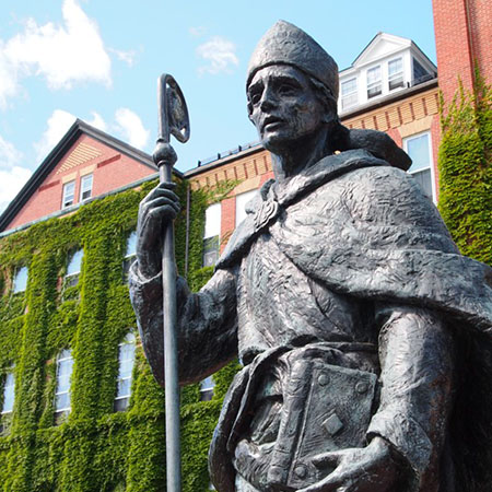 statue in front of alumni hall