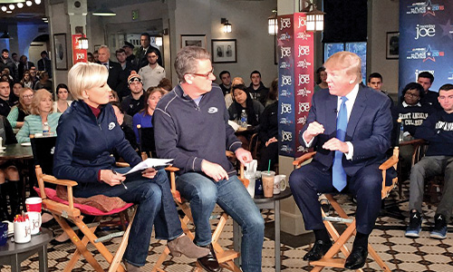 President Donald Trump speaks with the hosts of the "Morning Joe" in the campus coffee shop