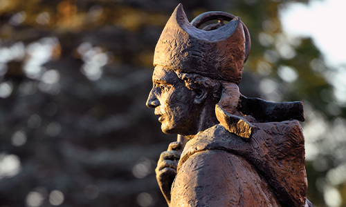 statue in front of alumni hall