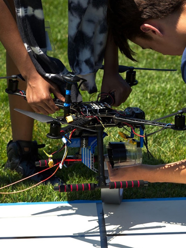 Students working on a drone