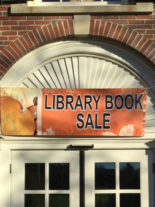 Library Book Sale sign above library door