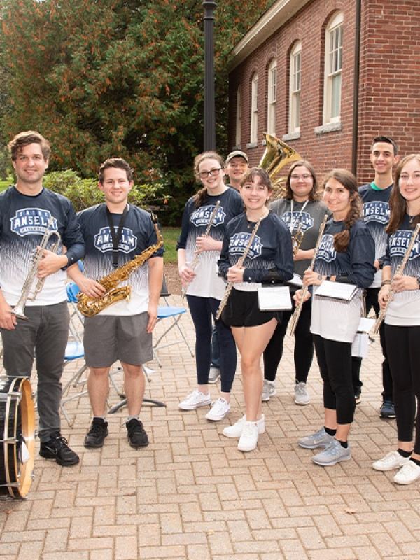 members of the pep band practice outside