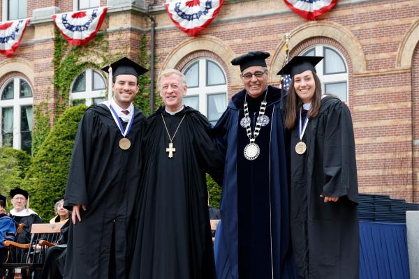 Alicia Kelley and Kevin Jordan with Abbot Mark Cooper and President Joseph Favazza