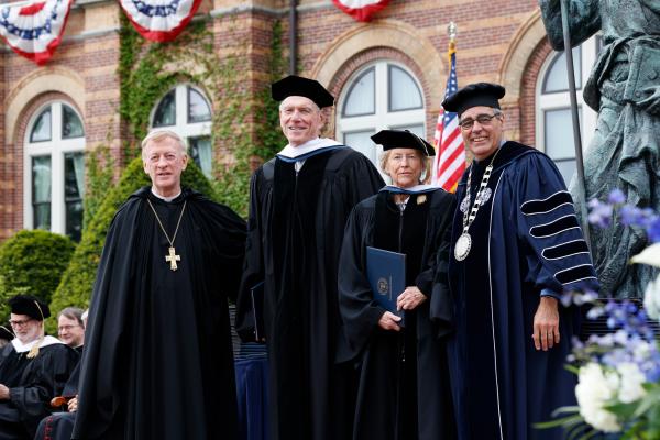 Honorary Degree recipients Lawrence and Patricia Pascal with President Favazza and Abbot Mark Cooper