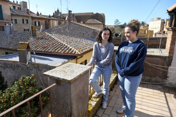 Two students on a rooftop in Tuscania