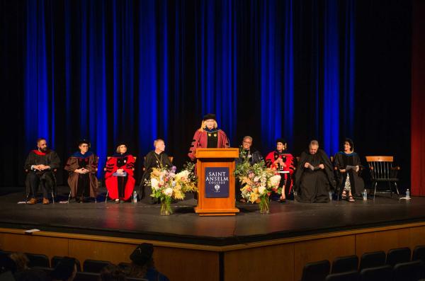 Emily Orlando giving a speech in the Koonz Theater for the convocation ceremony