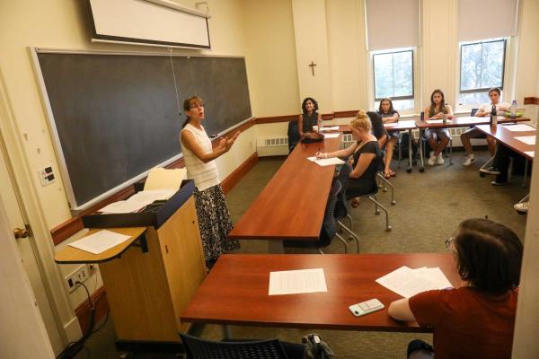 Professor Ann Holbrook and Emily Orlando '91 teaching an English class