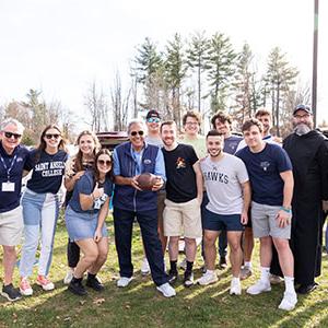 President Favazza with students at a football game.