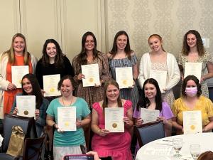 The 11 inductees of Kappa Delta Pi pose for a picture