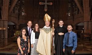 Br. Aloysius Sarasin, O.S.B. ’17, with his family and Abbot Mark Cooper, O.S.B. ’71, following his profession of solemn vows. Photo by Jeff Dachowski