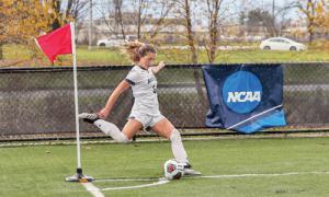 Saint Anselm player takes a corner kick