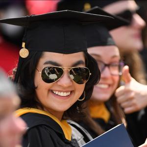 Student smiles at graduation