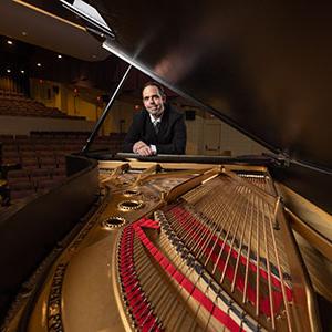 Sean Parr behind a piano