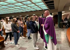 Student receives blessing in the Abbey Church