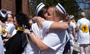 Nurses congratulating each other on graduation