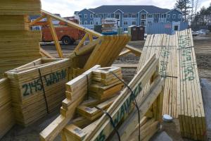 Roof trusses for two buildings are stored for construction in 2019 at The Residences at MacGregor Cut in Londonderry, where about a third of the completed apartments were designated as workforce housing.  Thomas Roy/Union Leader/file