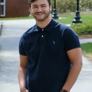 Guy Parenteau '23 stands outside Davison Hall