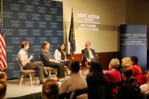 Journalists speak on stage