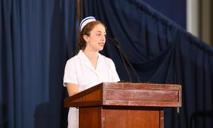 Student nurse giving speech at pinning ceremony