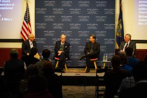 Constitutional scholars sitting on the stage for the panel at the NHIOP