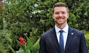 Connor O'Brien '21 smiling in a suit