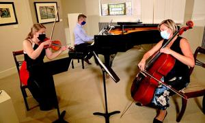 Fine arts faculty members inside the Alva de Mars Megan Chapel Art Center.