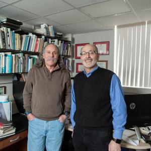 Professor Jay Pitocchelli and Professor David Guerra standing in an office