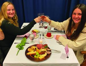 Two students celebrating Valentines in Davison Hall