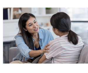 Parent speaking comfortingly to her child