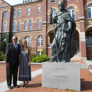 Dr. Favazza and Holmes Scholar Mary Kocev standing next to the statue of St. Benedict