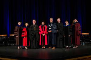 From left: Christine Gustafson, Ph.D., Vice President of Academic Affairs Sheila Liotta, Ph.D., Abbot Mark Cooper, O.S.B. ’71, President Joseph A. Favazza, Ph.D., Emily Orlando, Ph.D. ’91, President Emeritus Father Jonathan DeFelice ’69, Ann Holbrook, Ph.D., and Diana Terrell, Ph.D.