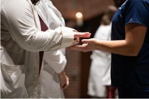 Close up of the blessing of the hands