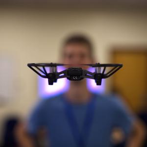 Drone hovering in front of a students face
