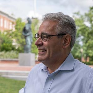 President Favazza standing on Alumni Quad