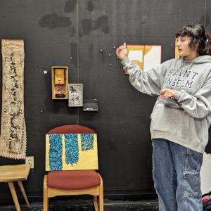 Student presenting artwork in the Fine Arts department