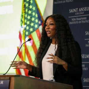 A woman speaking at the MLK Dinner