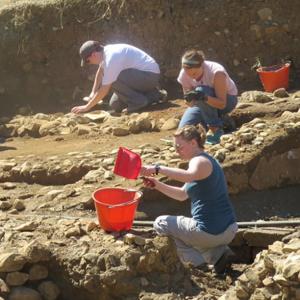 students excavating