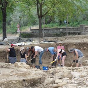 Students working at a dig site