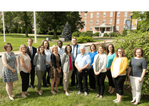 12 new faculty members gathered on campus green