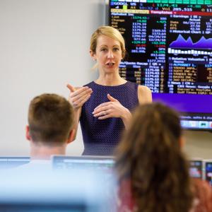 professor lecturing students in a classroom