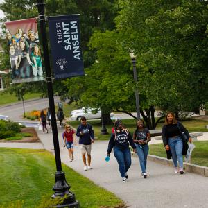 students walking next to the Jean Student Center