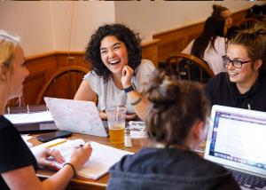 students at a table talking