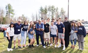 President Favazza with students at a football game.